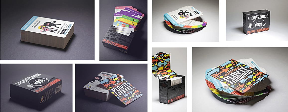 Sneaky Cards on a desk with a coffee cup and an open notebook